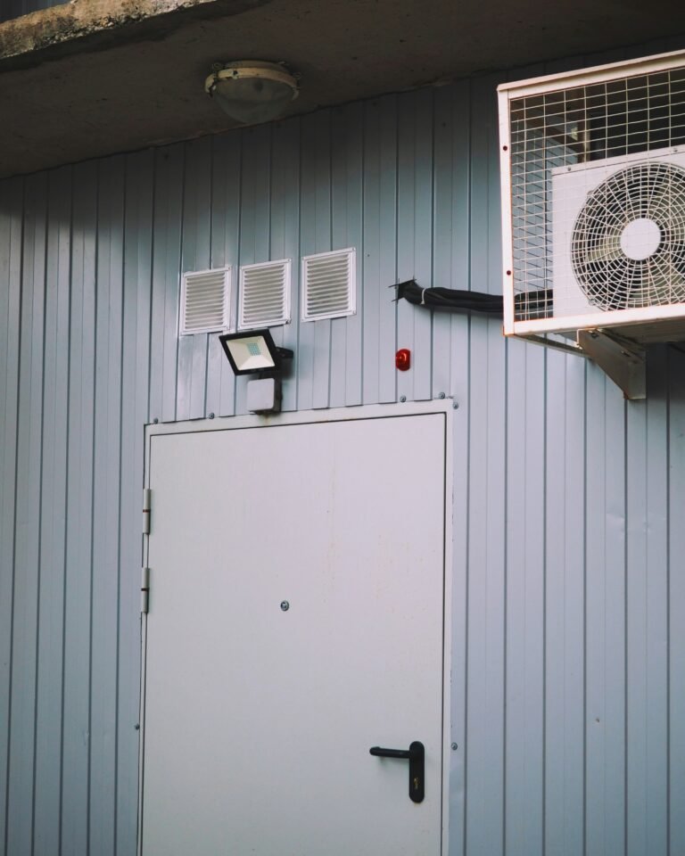 a wall mounted air conditioner next to a door